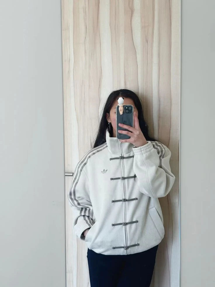 Modern streetwear jacket with fusion design and striped sleeve detailing
