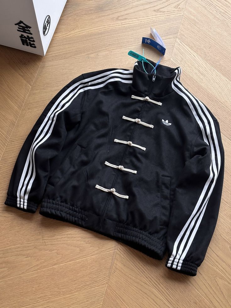 Black CNY inspired streetwear jacket with Chinese loop button closure
